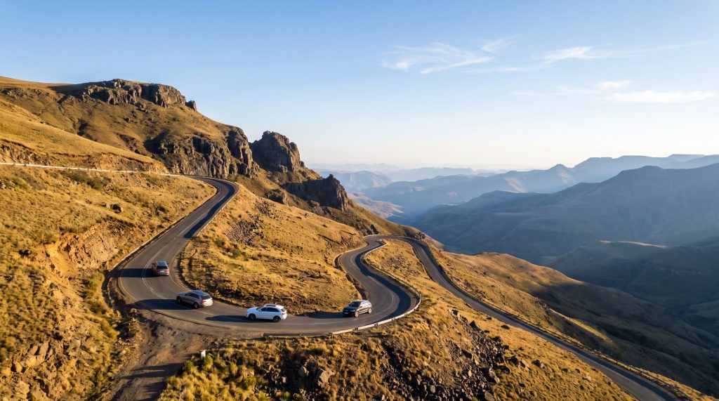 Illustration of a convoy of 4x4s climbing a tarred mountain pass in Lesotho